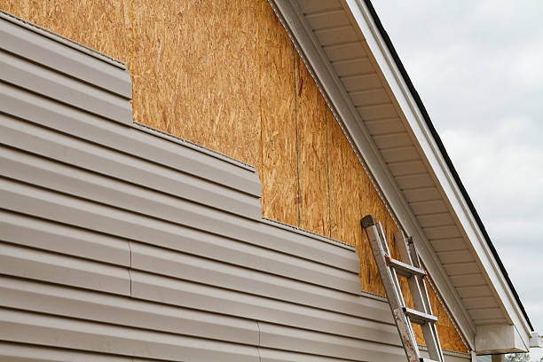 Professional Storm Damage Siding Repair technician working in Christiana, PA